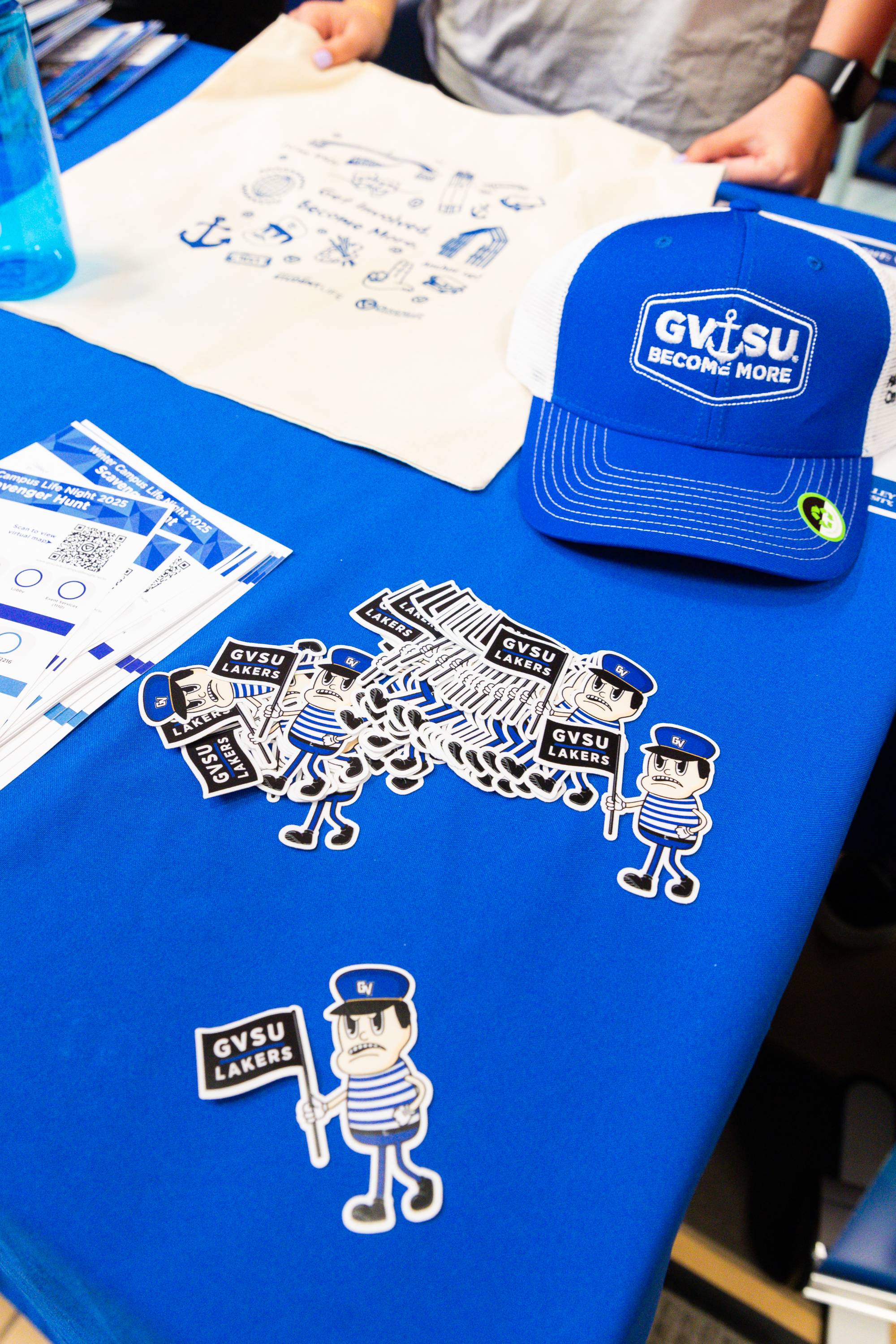 Cartoon Louie the Laker stickers on a blue table cloth